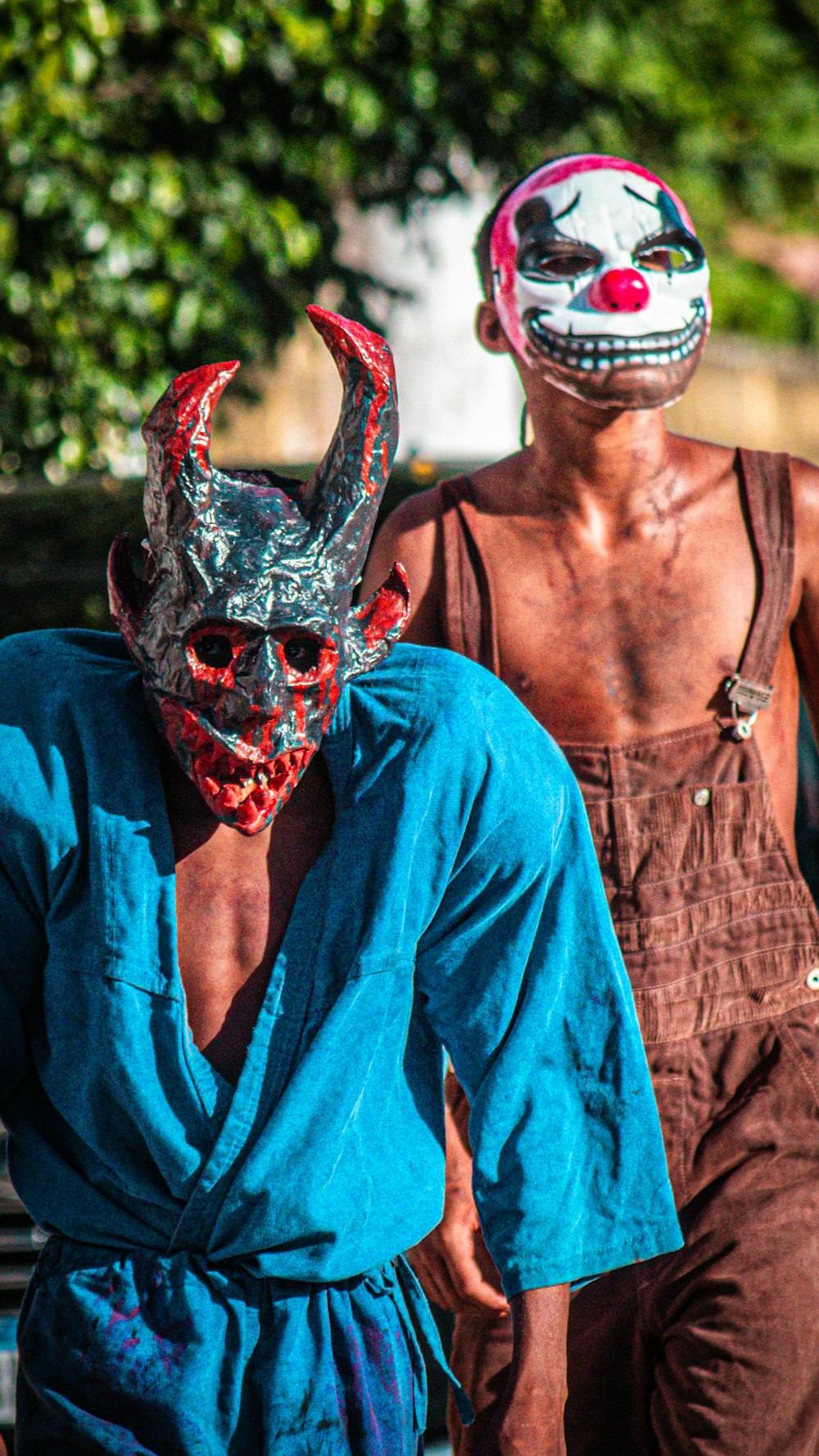 a couple of men walking down a street