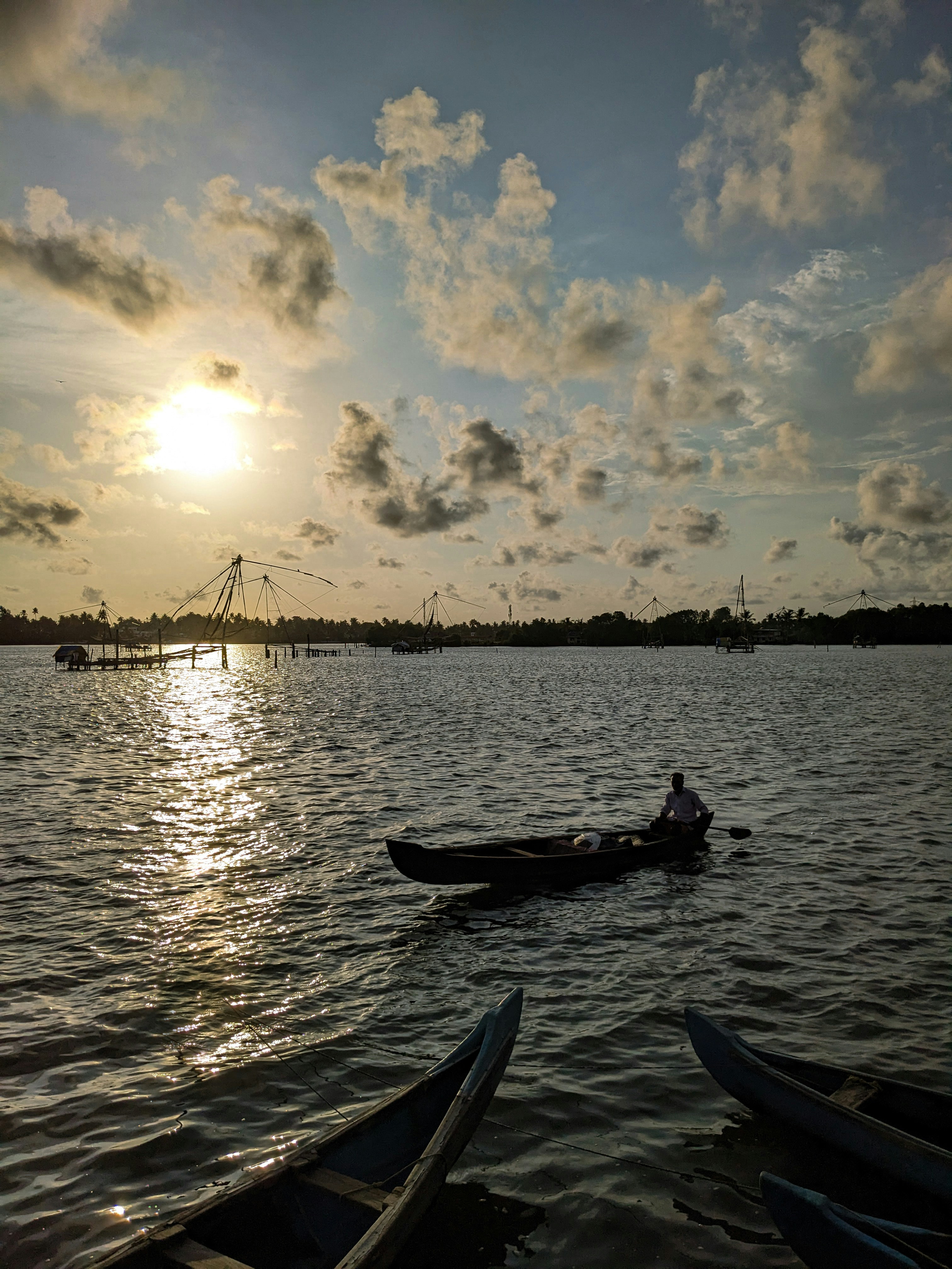 a couple of boats floating on top of a lake