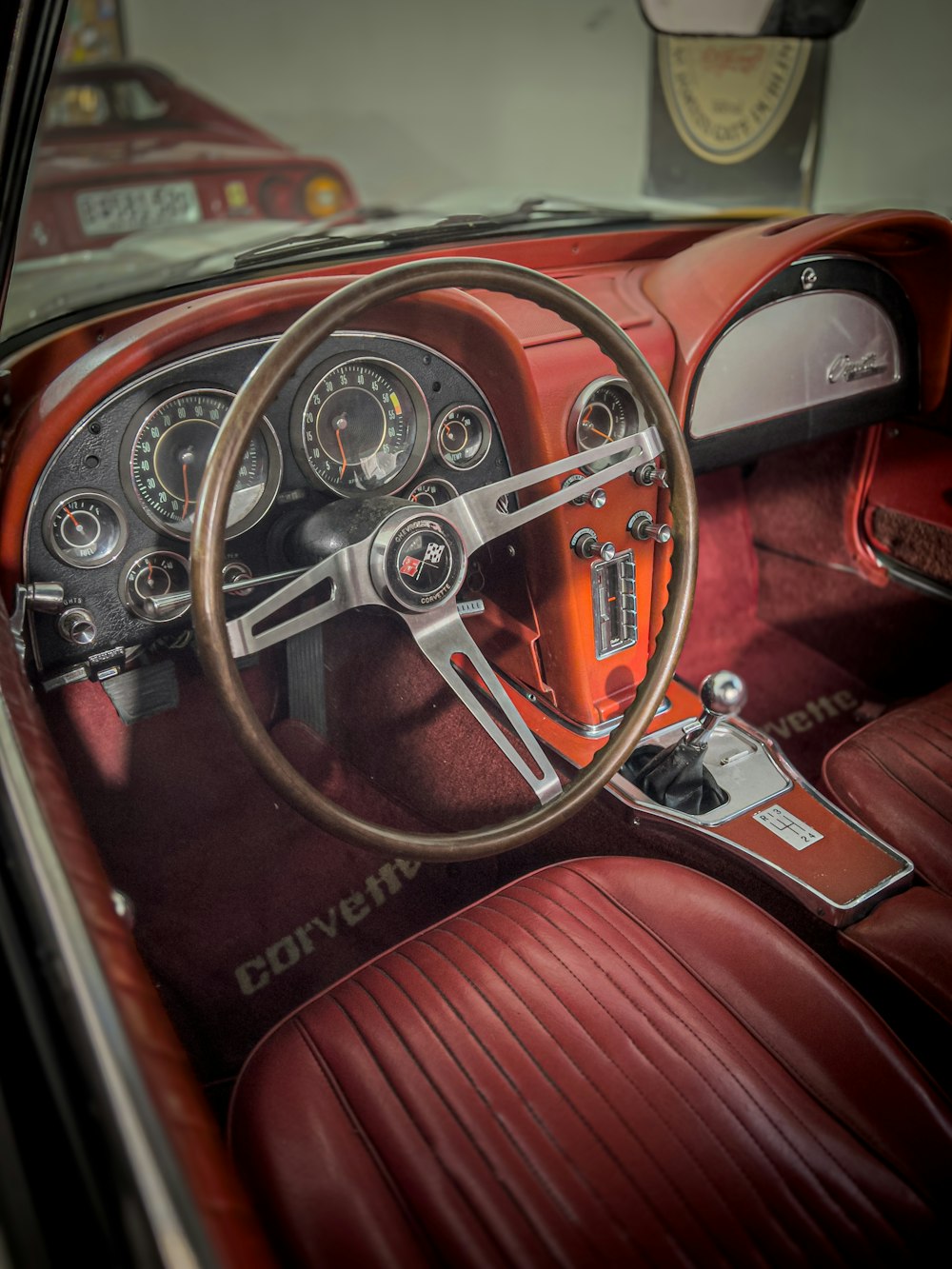 the interior of a car with a steering wheel and dashboard