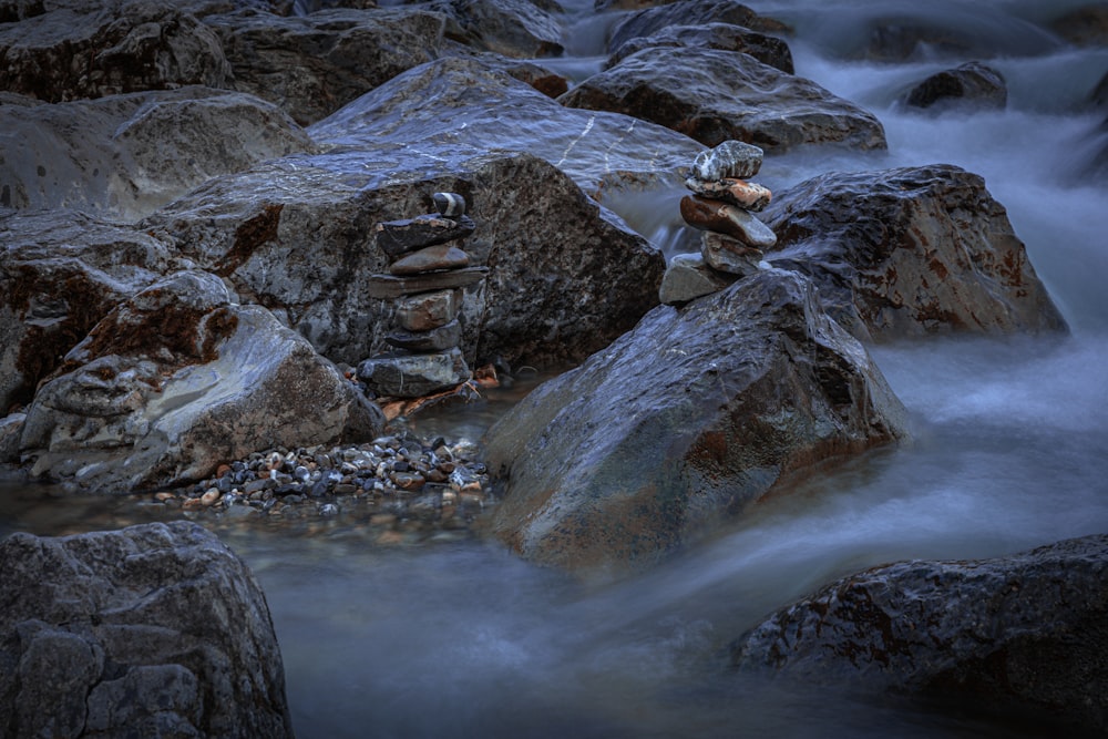 a stream of water running between large rocks