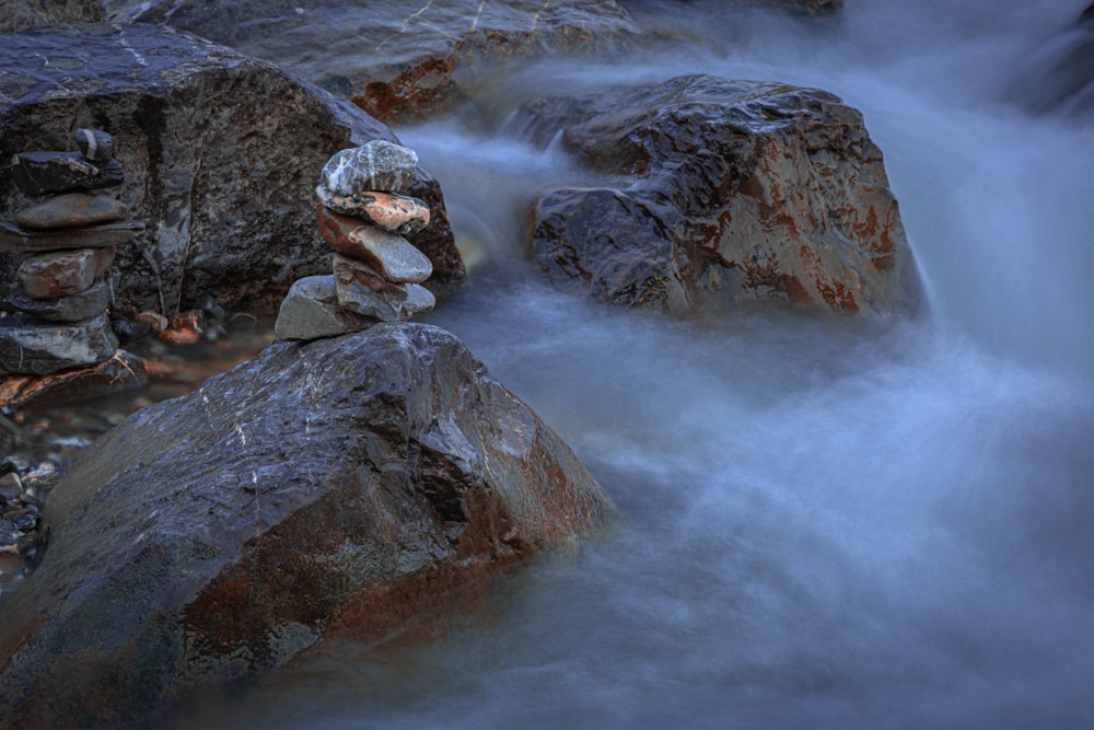 a stream of water running over rocks in a river