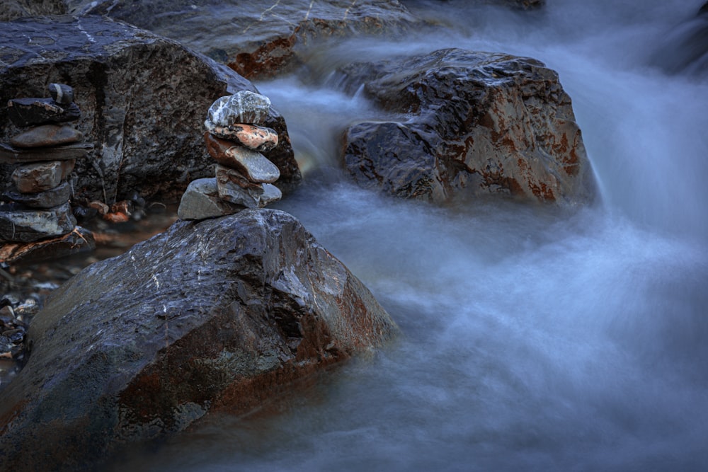 a stream of water running over rocks in a river