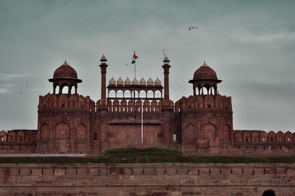 a large brick building with two towers on top of it