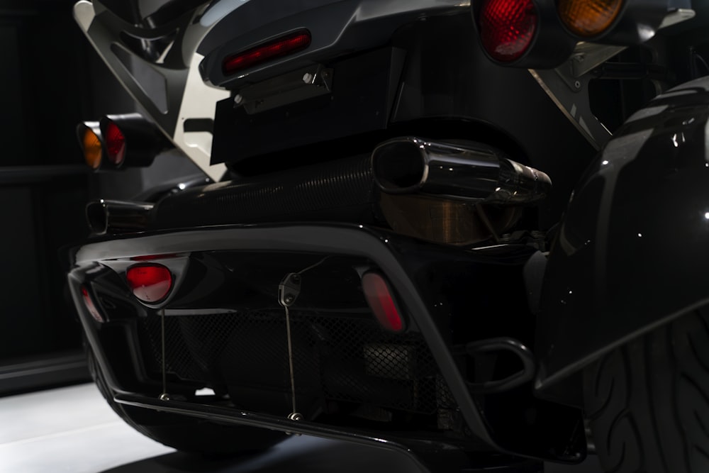 the rear end of a motorcycle parked in a garage