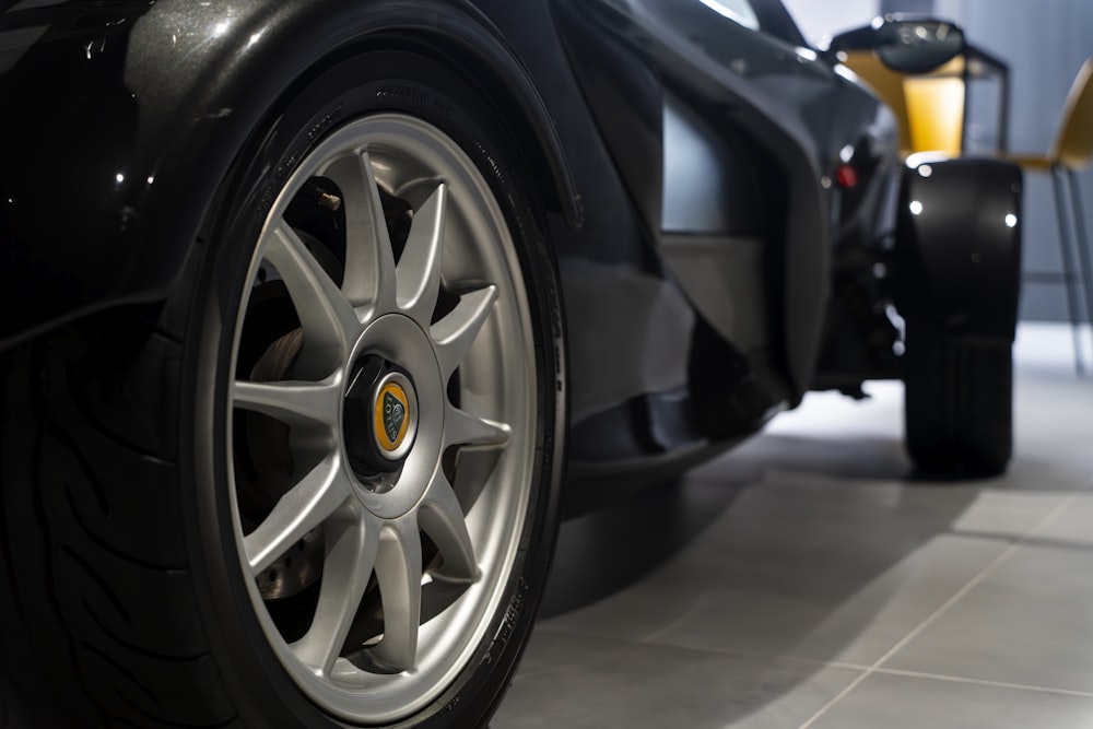 a close up of the front wheels of a sports car