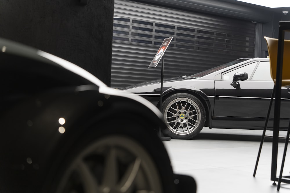 a black sports car parked in a garage