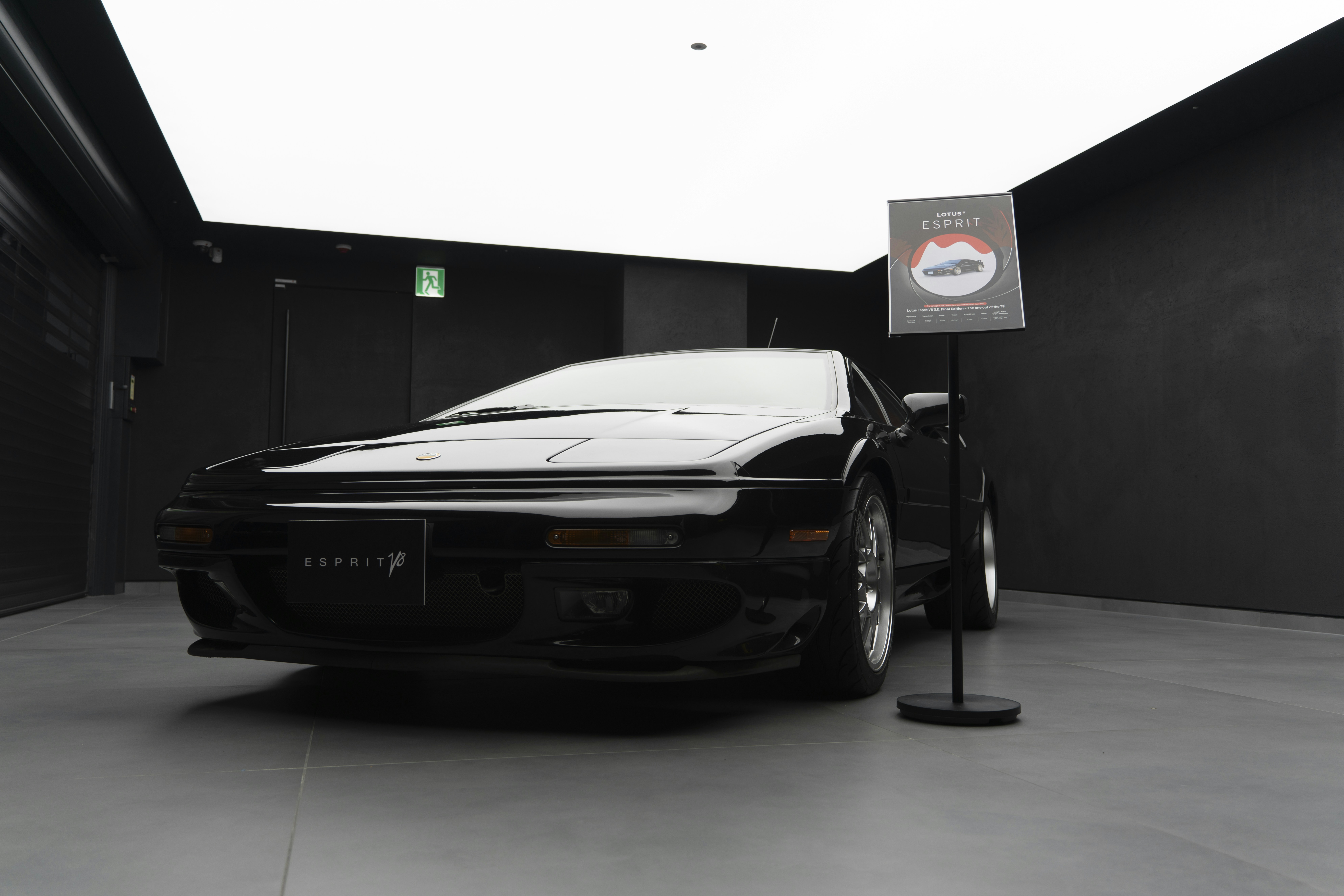 Image 4 clearly shows a Lotus Esprit (badge visible) in a display setting, directly matching the article
