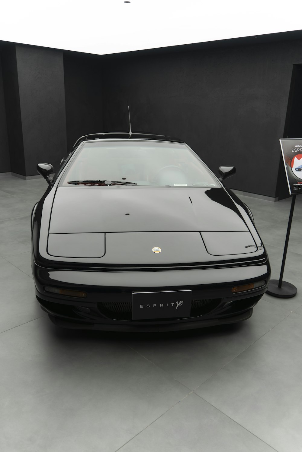 a black sports car parked in a garage