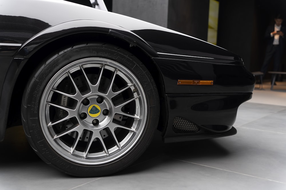 a black sports car parked in a garage