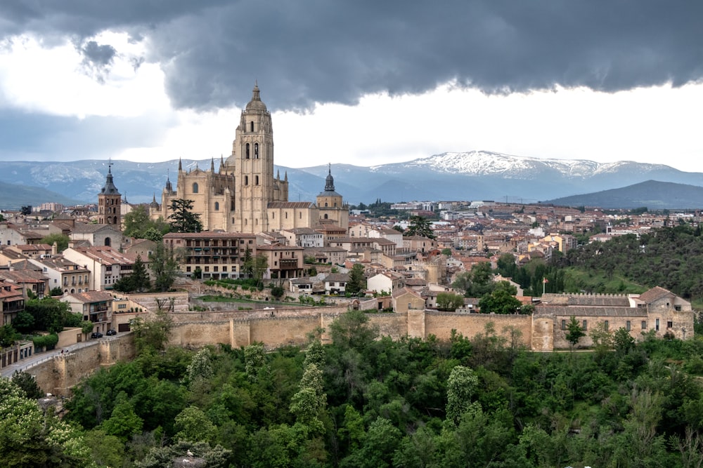 a view of a city with mountains in the background