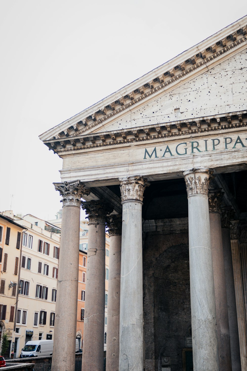 a large building with columns and a sign on it