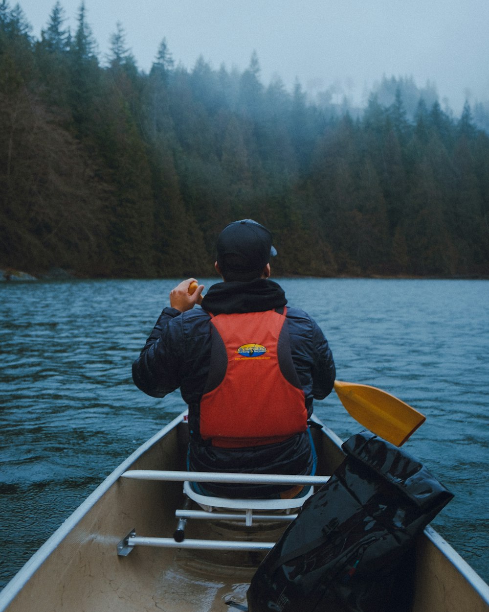 a man in a boat on a body of water