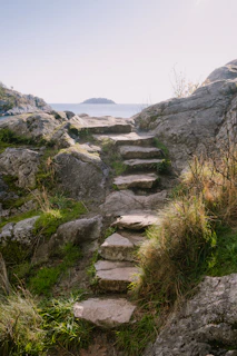 a set of stone steps leading to the ocean