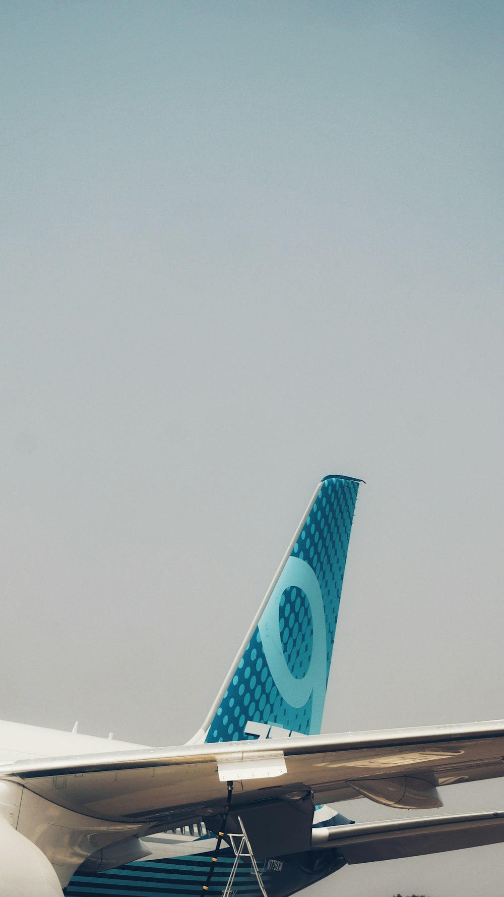 a large jetliner sitting on top of an airport tarmac