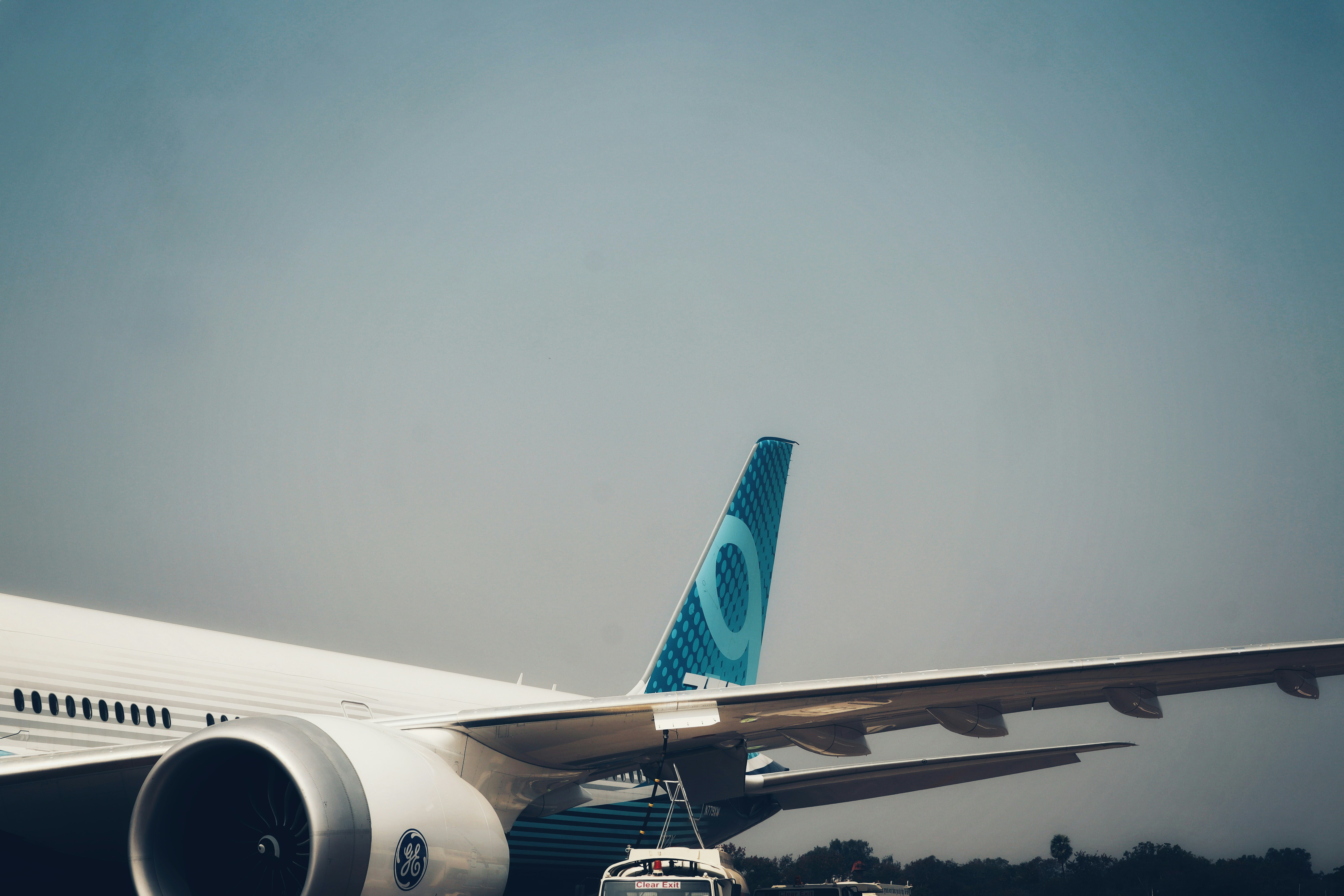 a large jetliner sitting on top of an airport tarmac, Boeing 777x at Wings India 2024