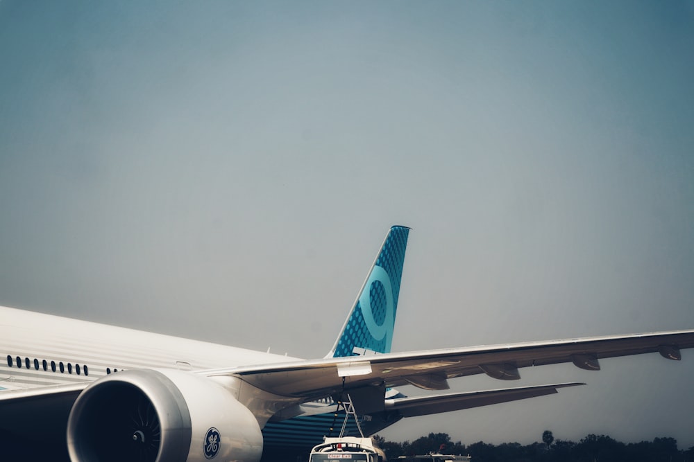 a large jetliner sitting on top of an airport tarmac