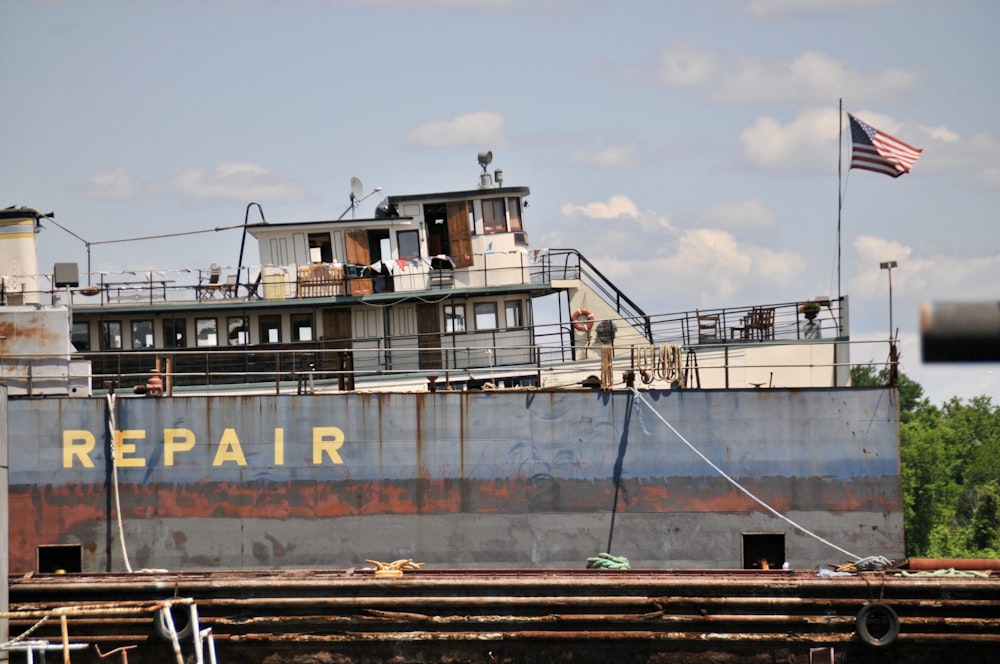 a large boat with a flag on top of it