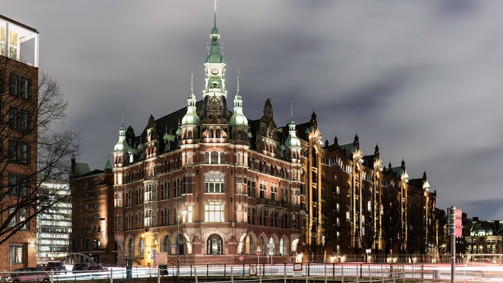 a very tall building with a clock tower at night