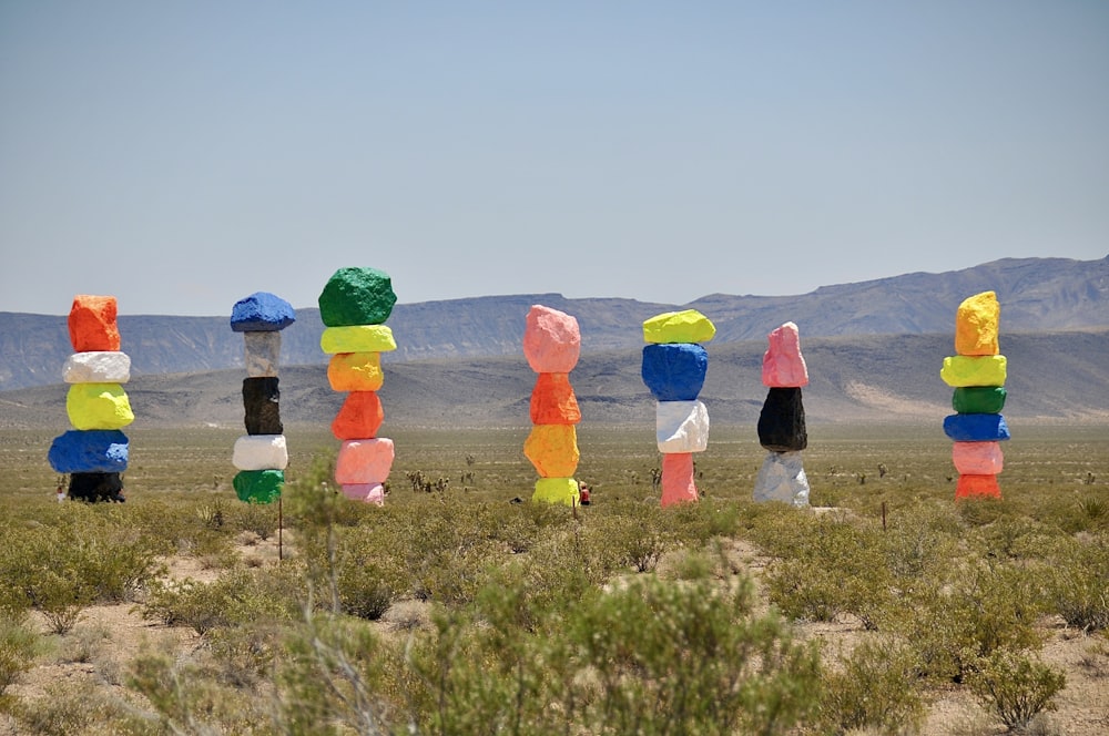 a group of sculptures in the middle of a desert