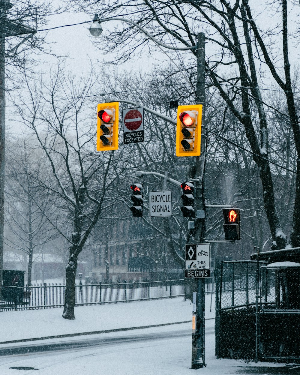 a couple of traffic lights hanging from a pole