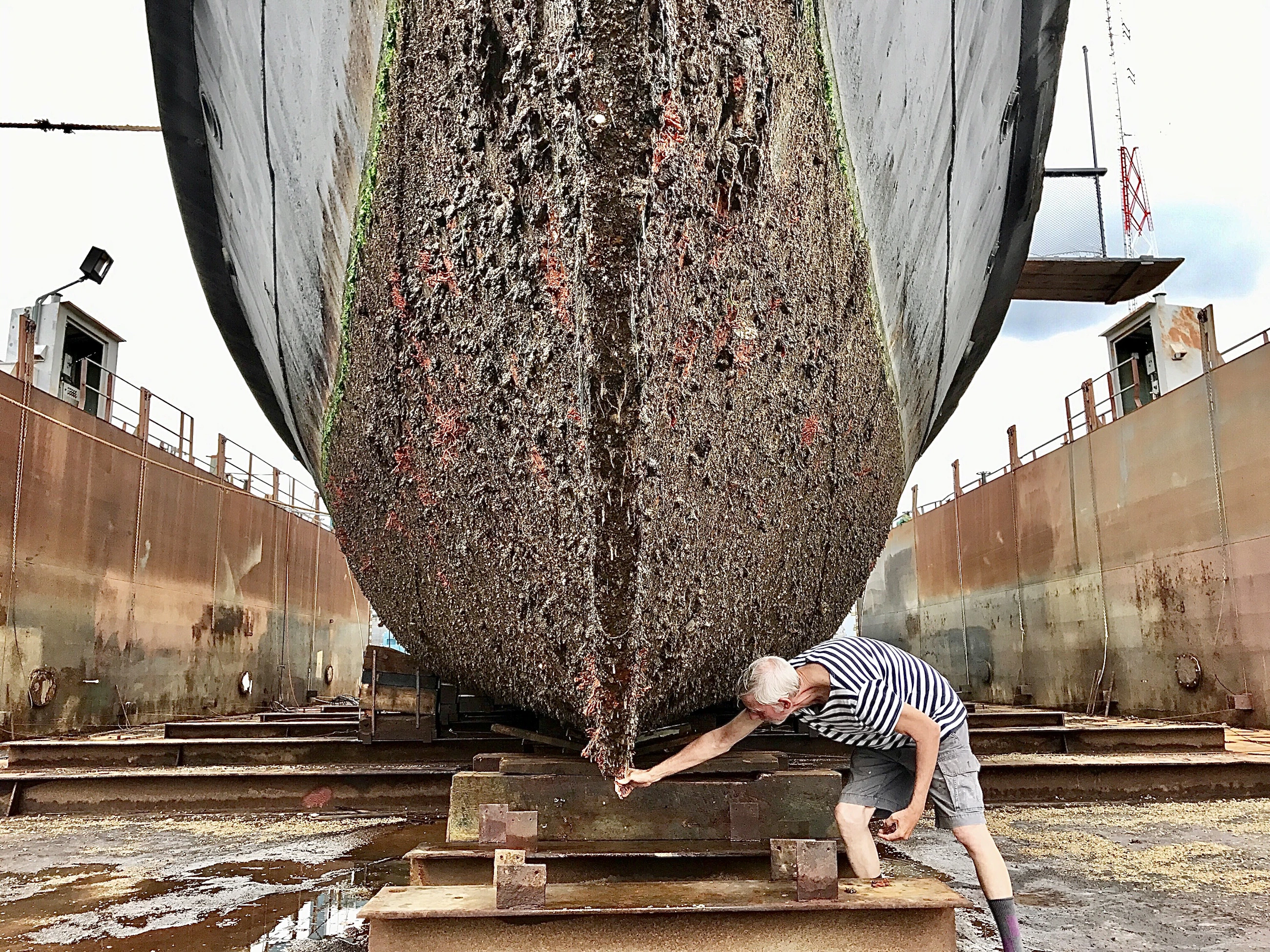 Marine repair work being carried out on a vessel in dry dock