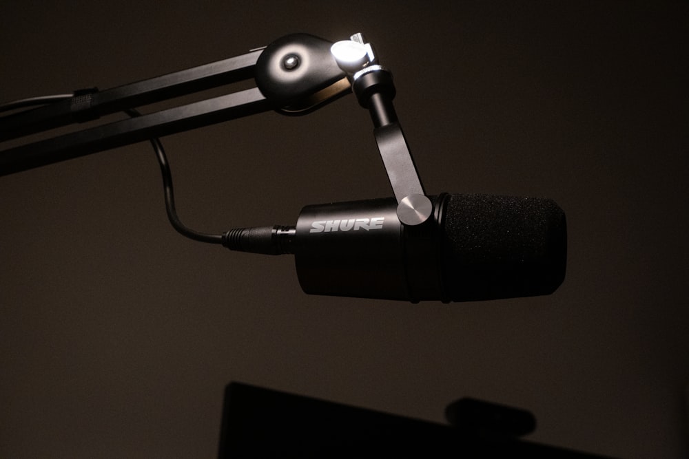 a close up of a microphone with a black background