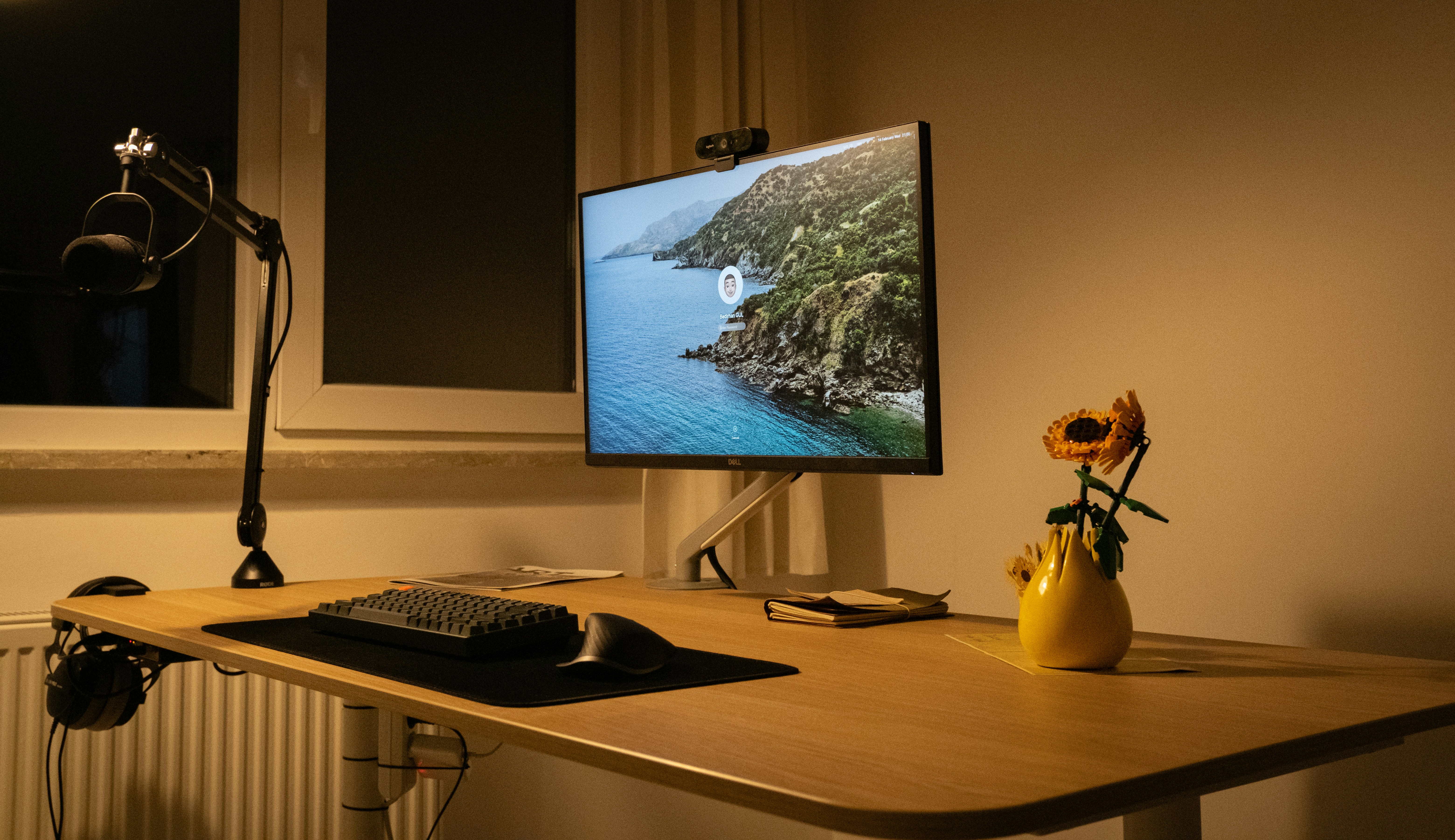 a computer monitor sitting on top of a wooden desk
