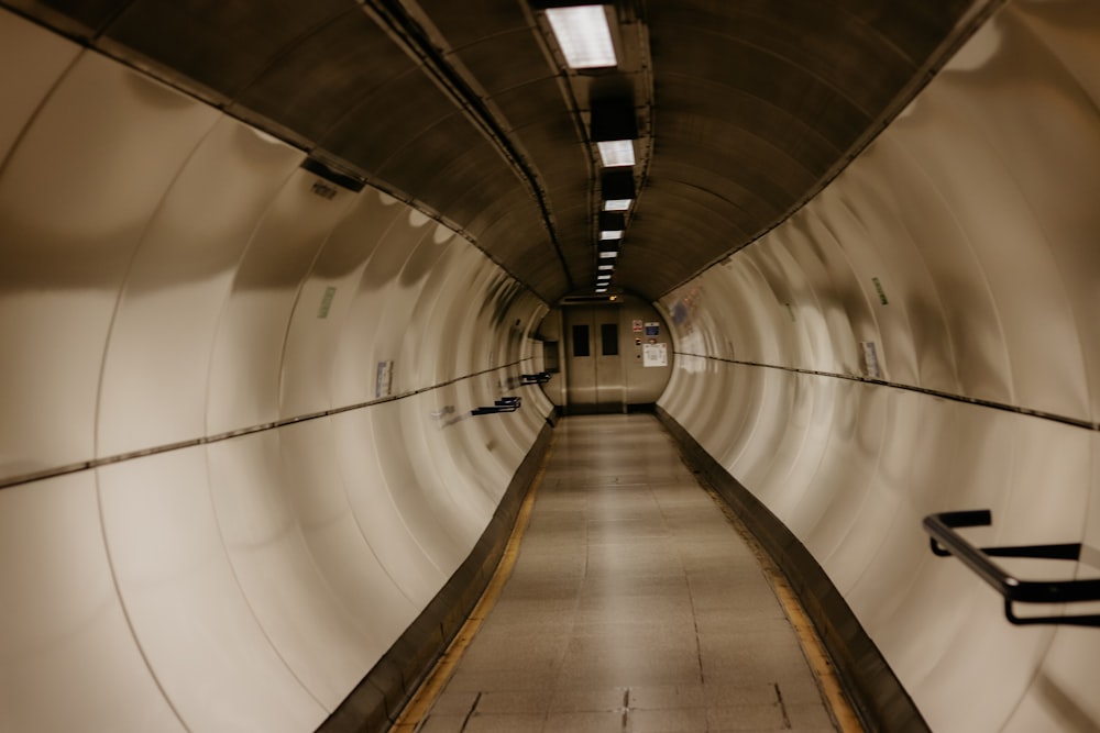 a long tunnel with a bench in the middle of it