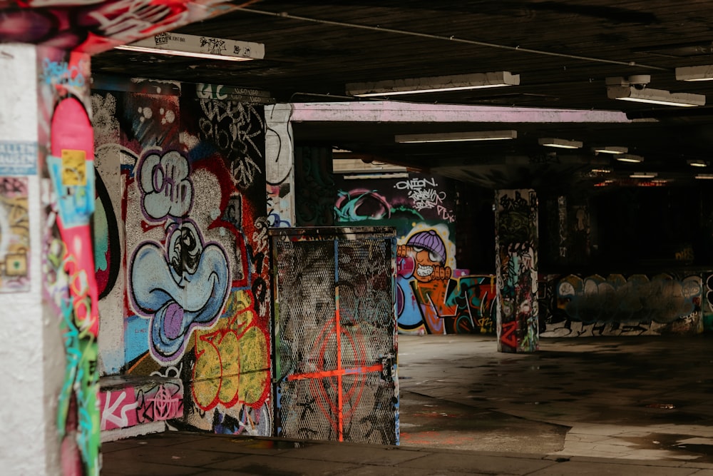 a parking garage with graffiti all over the walls