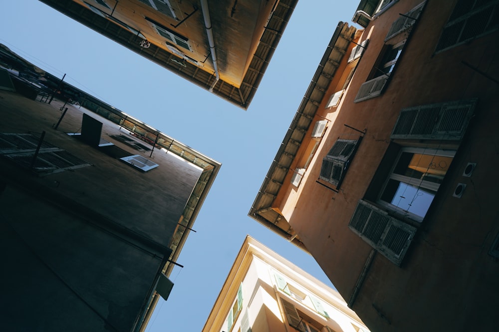 looking up at a tall building with windows