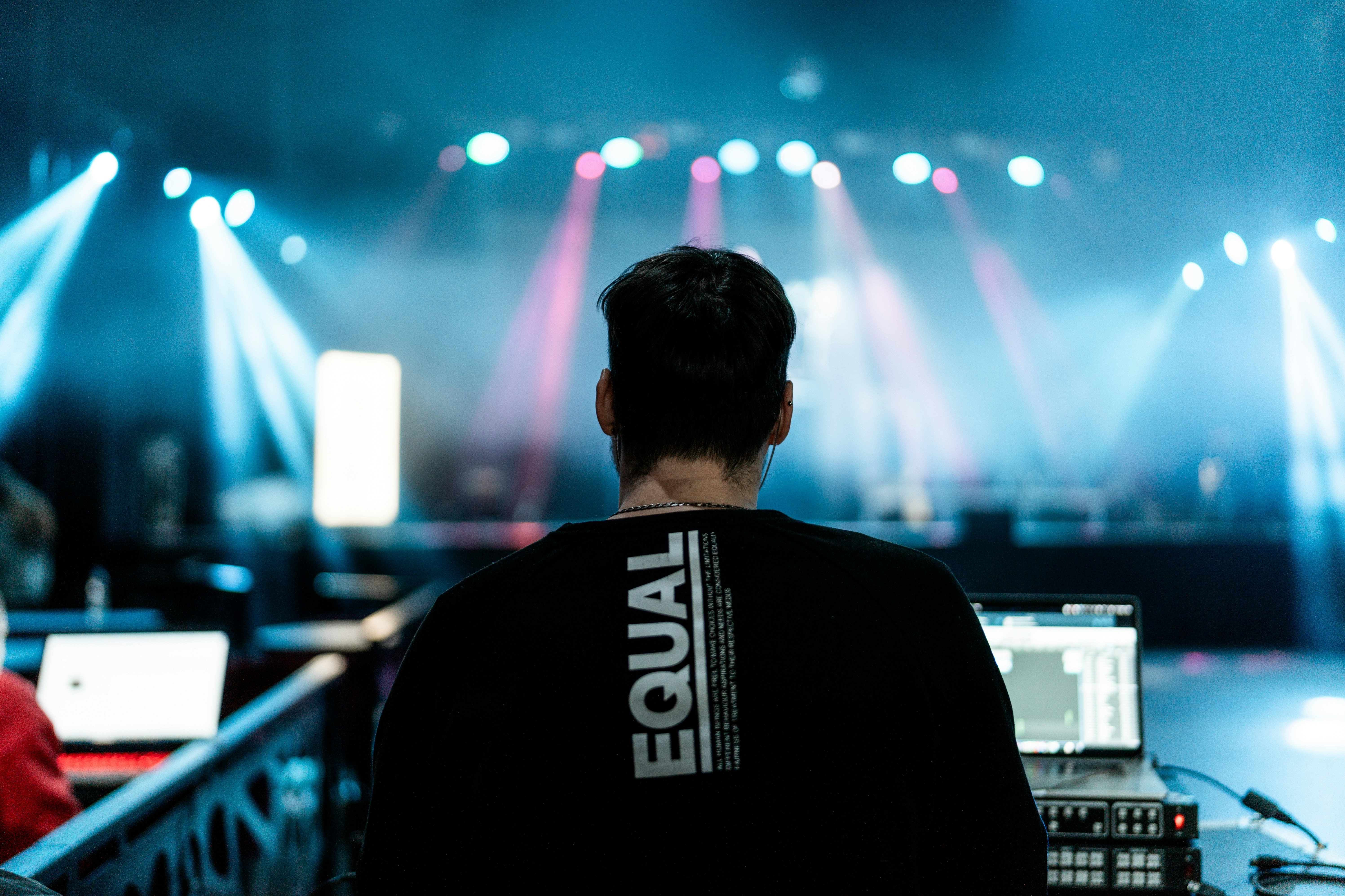 a man sitting in front of a laptop computer