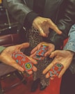 a couple of people that are holding something in their hands