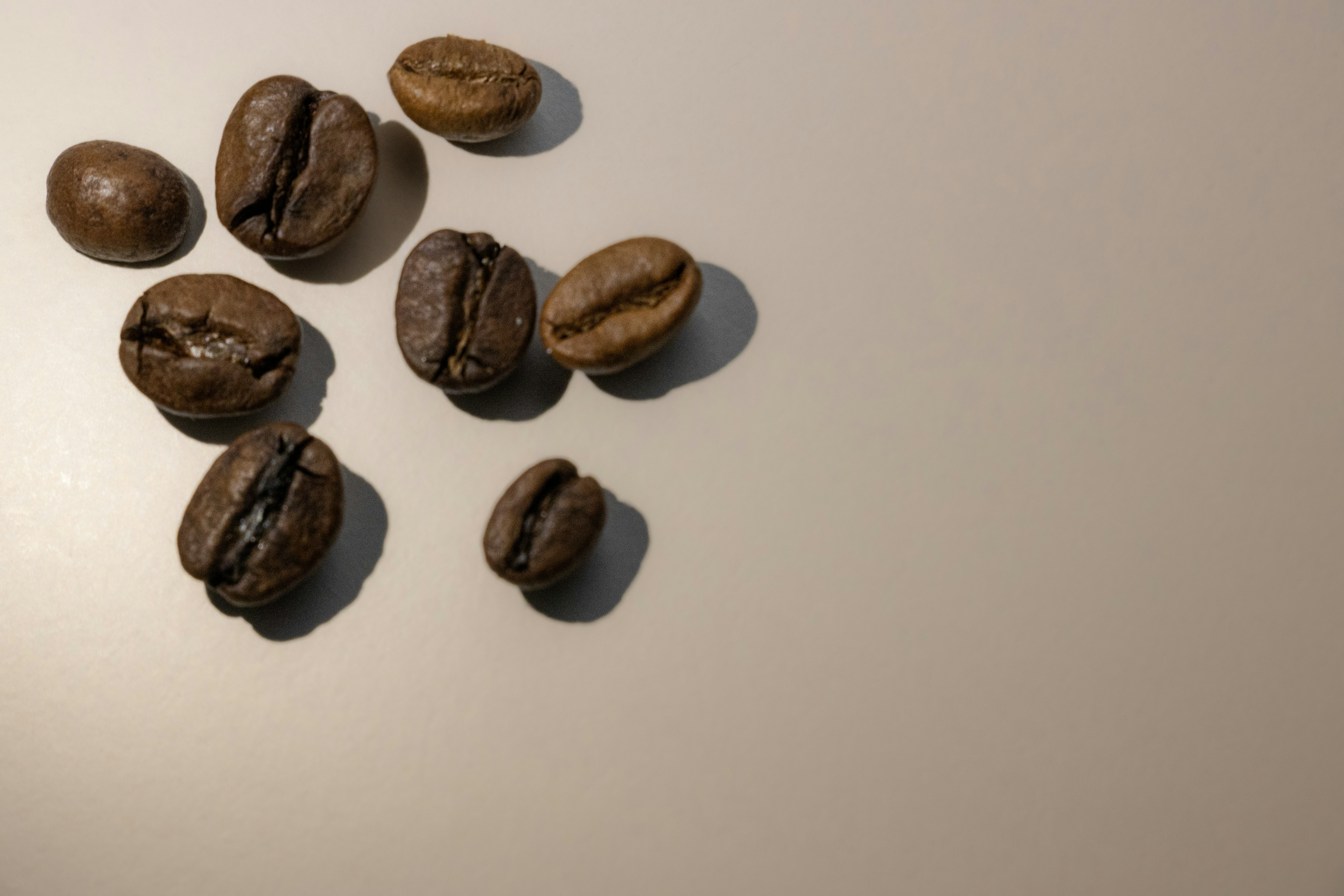a group of coffee beans sitting on top of a table