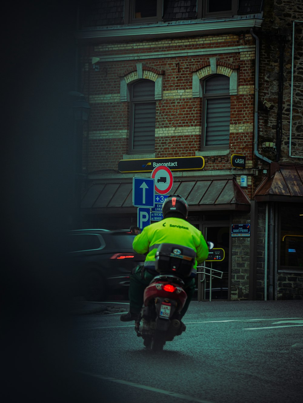 a person riding a motorcycle on a city street