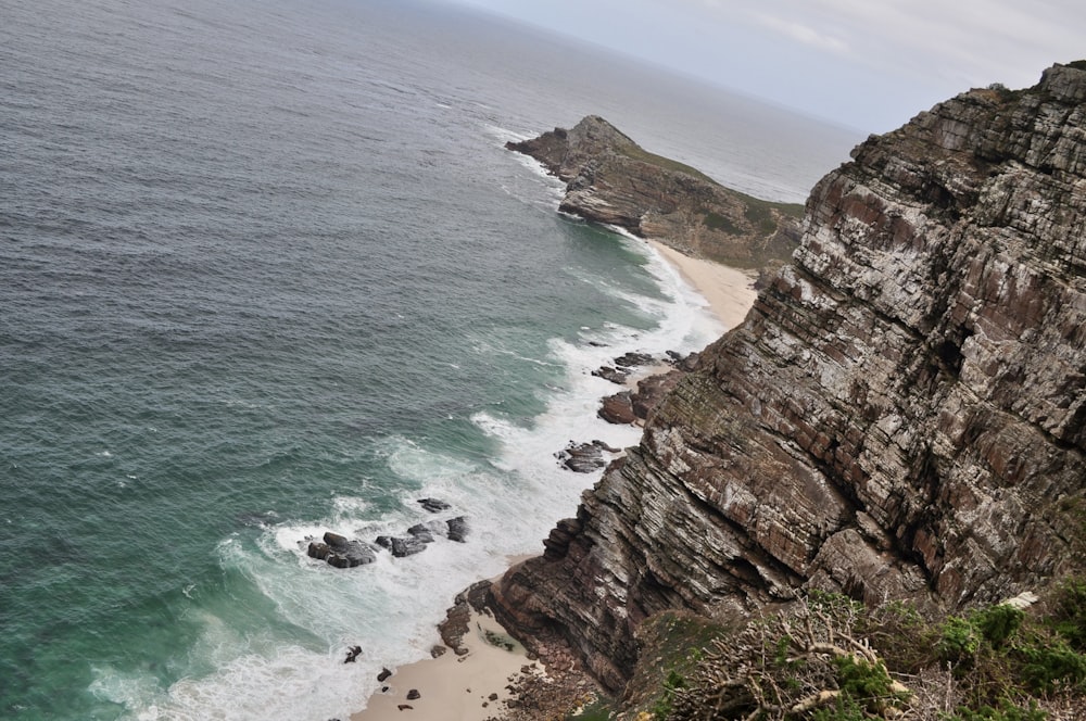 a view of the ocean from the top of a cliff