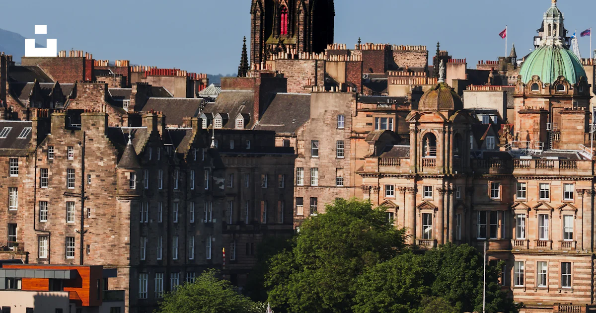 Calton Building A view of a city with a very tall building photo – Free Calton hill ...