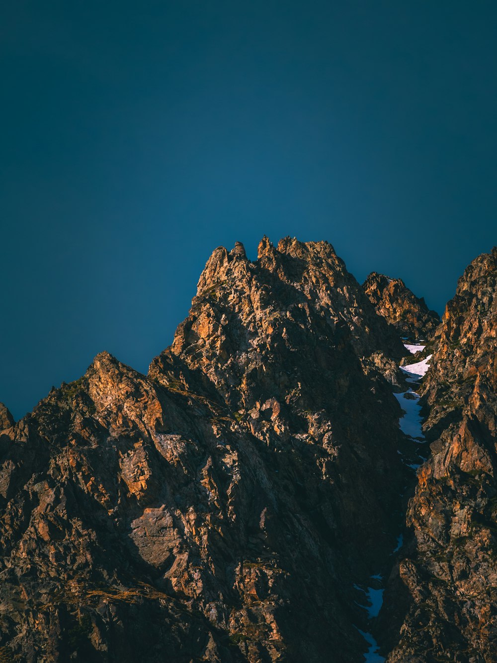 the top of a mountain with snow on it