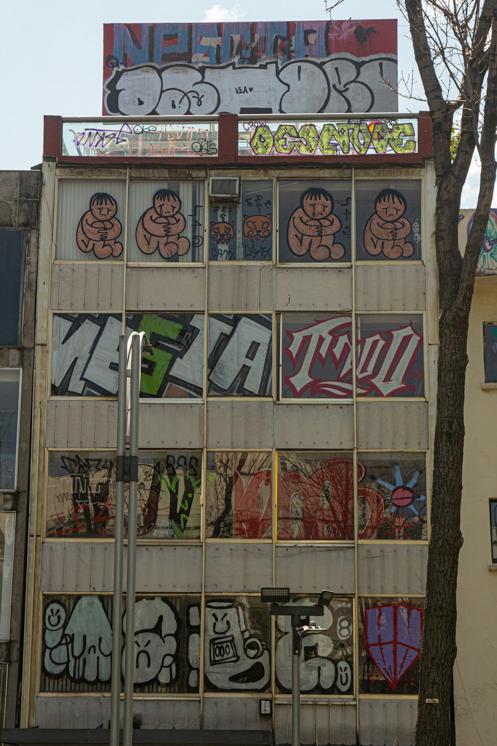 a tall building with graffiti on the side of it