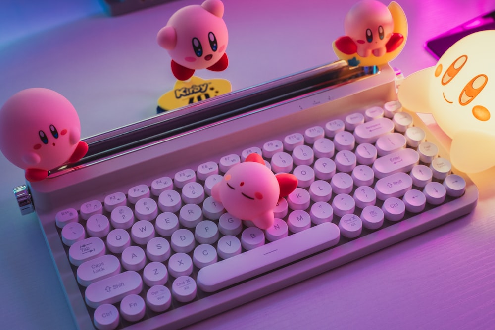 a computer keyboard sitting on top of a desk