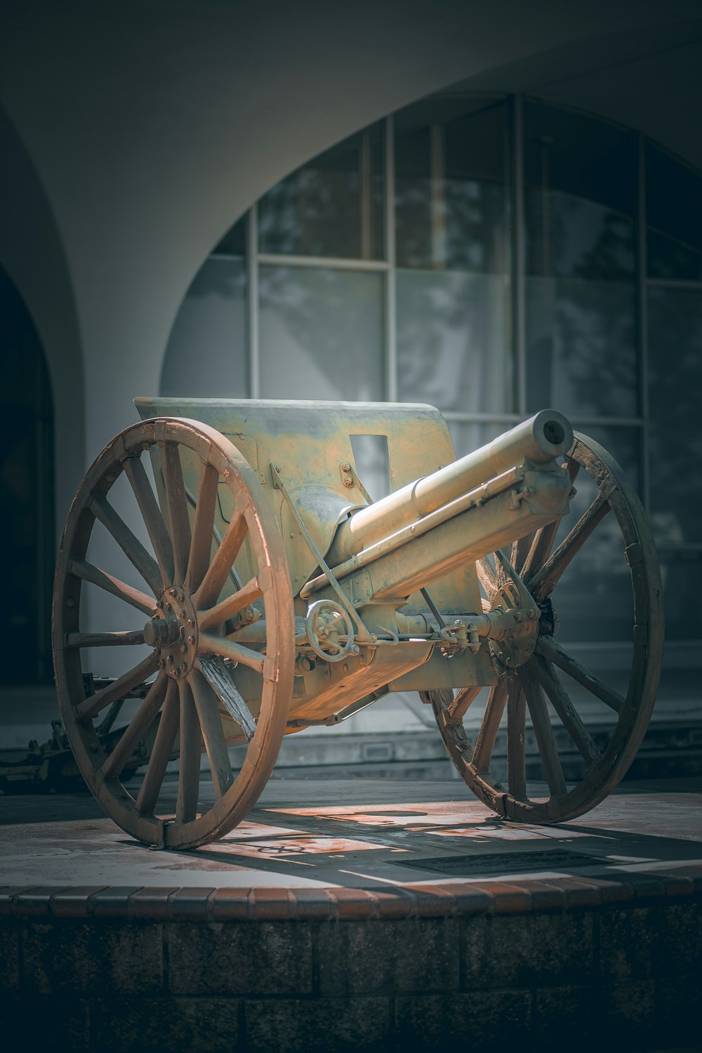 a large wooden cannon sitting on top of a stone platform