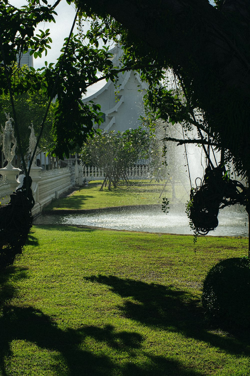 a park with a fountain in the middle of it