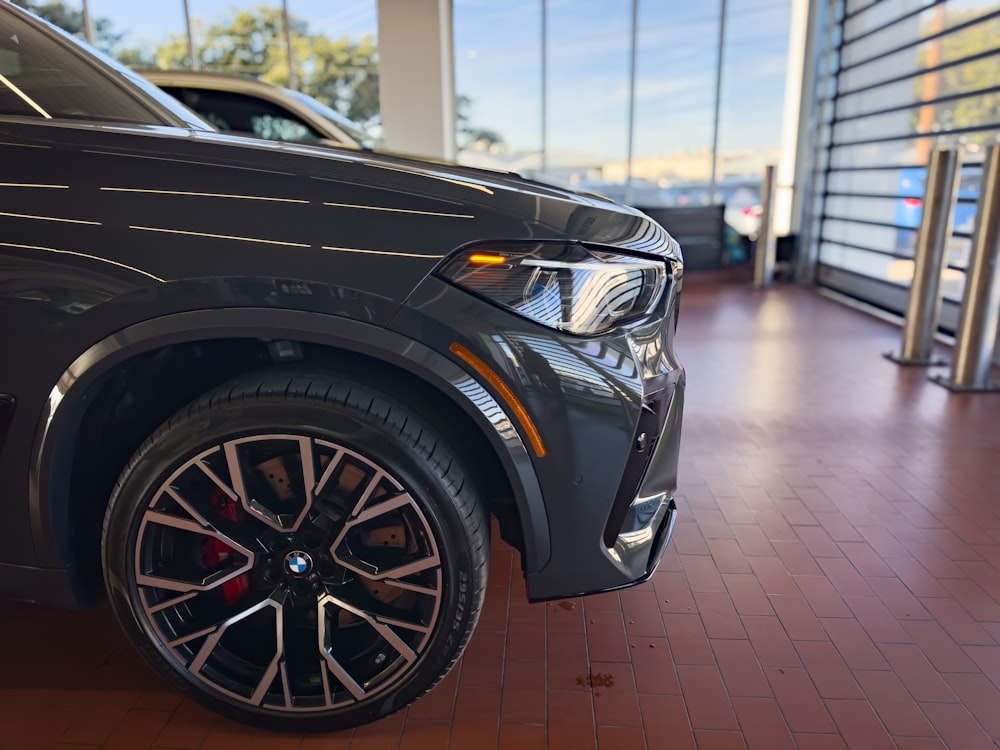 a bmw car is parked in a showroom