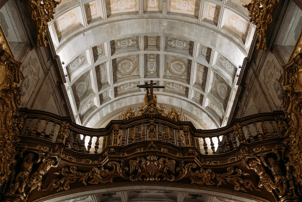 a cross hanging from the ceiling of a church