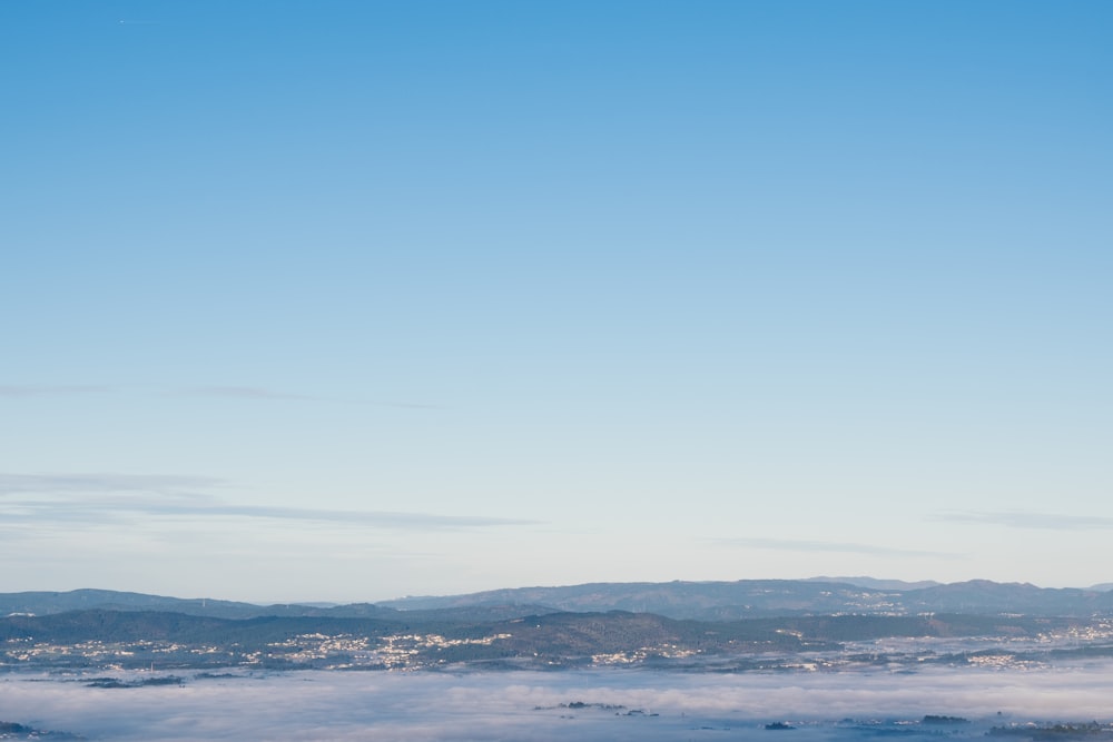 a view of a city with mountains in the distance