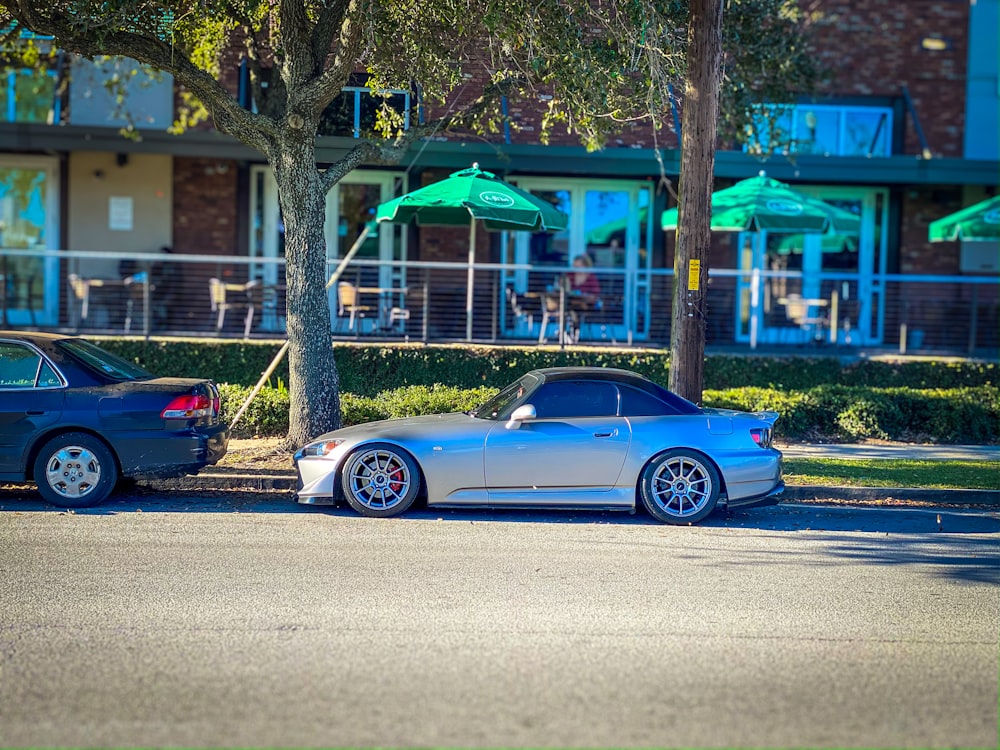 two cars parked on the side of the road