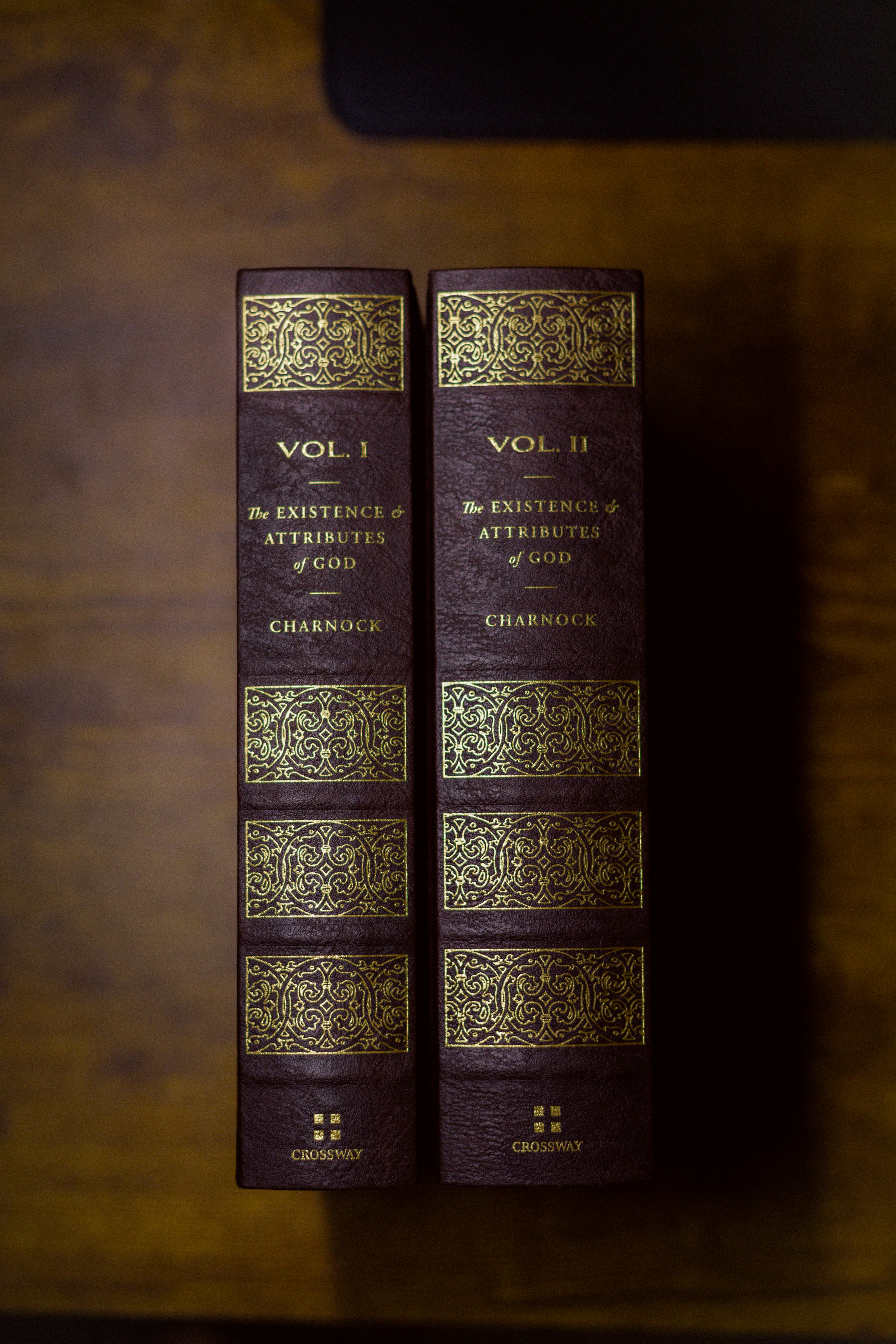 two books sitting on top of a wooden table