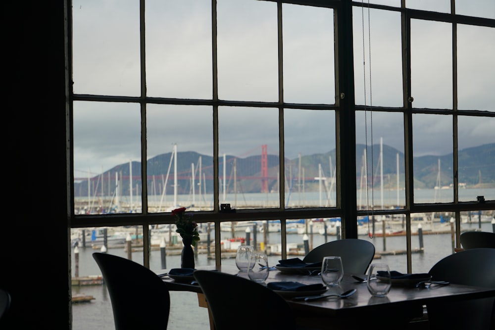 a restaurant with a view of a bay and a bridge