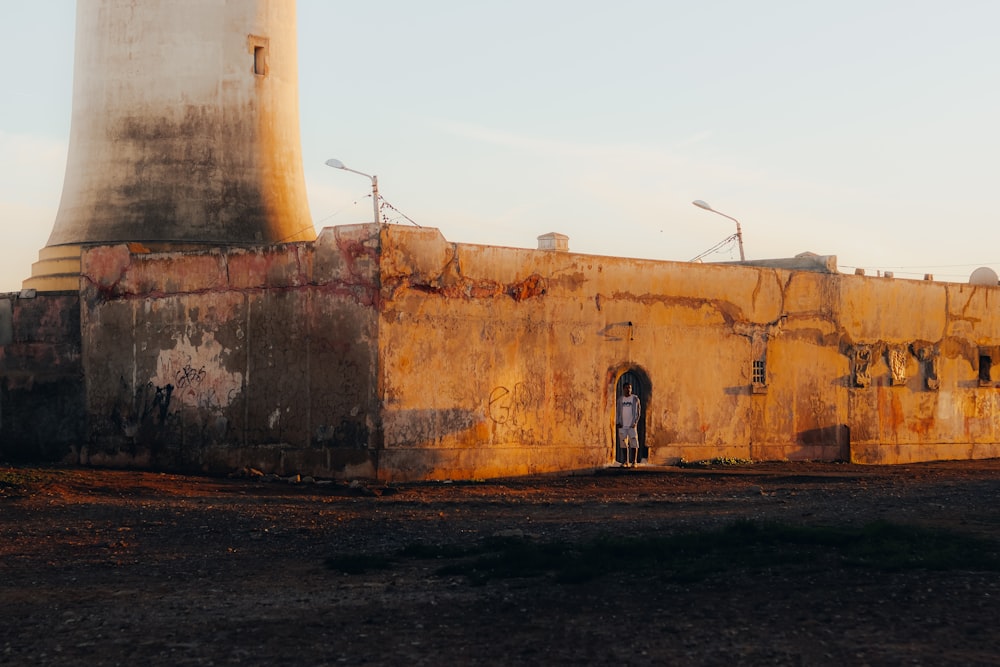 an old building with a light tower in the background