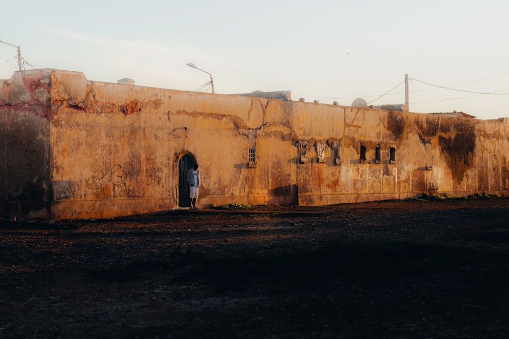 an old building with graffiti on the side of it