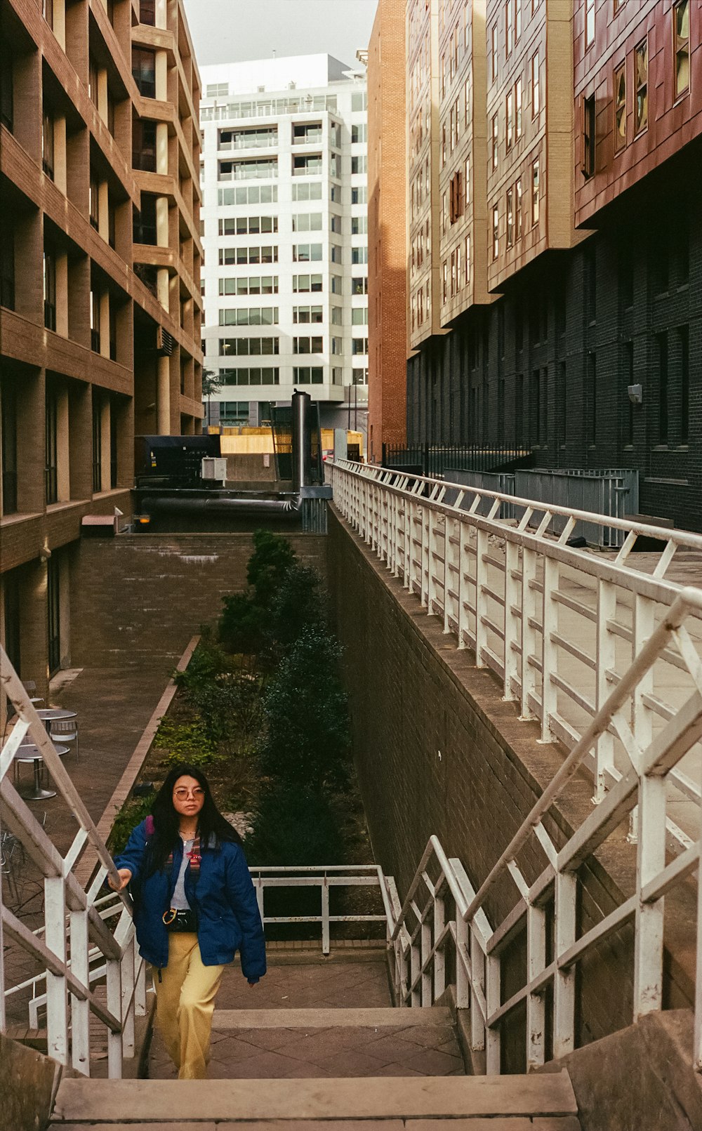 a woman walking down a flight of stairs